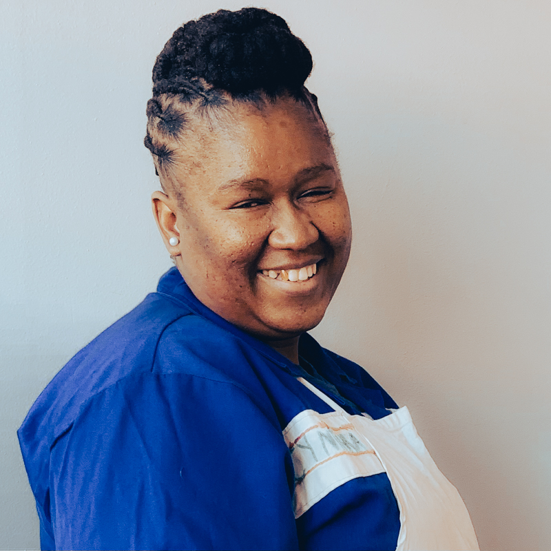 Say hello to Cynthia, Chief Winder on the Cowgirlblues team, in a head and shoulders shot smiling at the camera